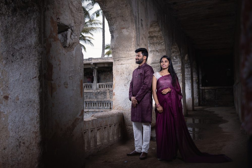 Couple portrait in a heritage stone corridor