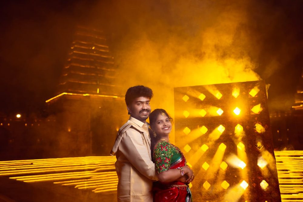 Couple portrait with dramatic golden night lighting